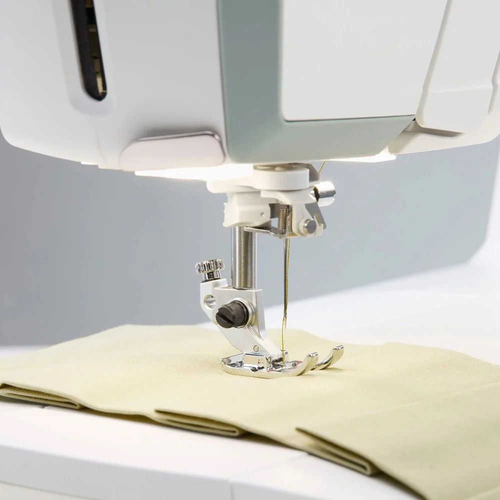 Husqvarna Viking Topaz 55Q sewing machine needle and presser foot stitching fabric with precision feed system