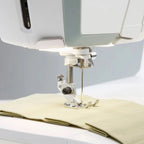 Husqvarna Viking Topaz 55Q sewing machine needle and presser foot stitching fabric with precision feed system