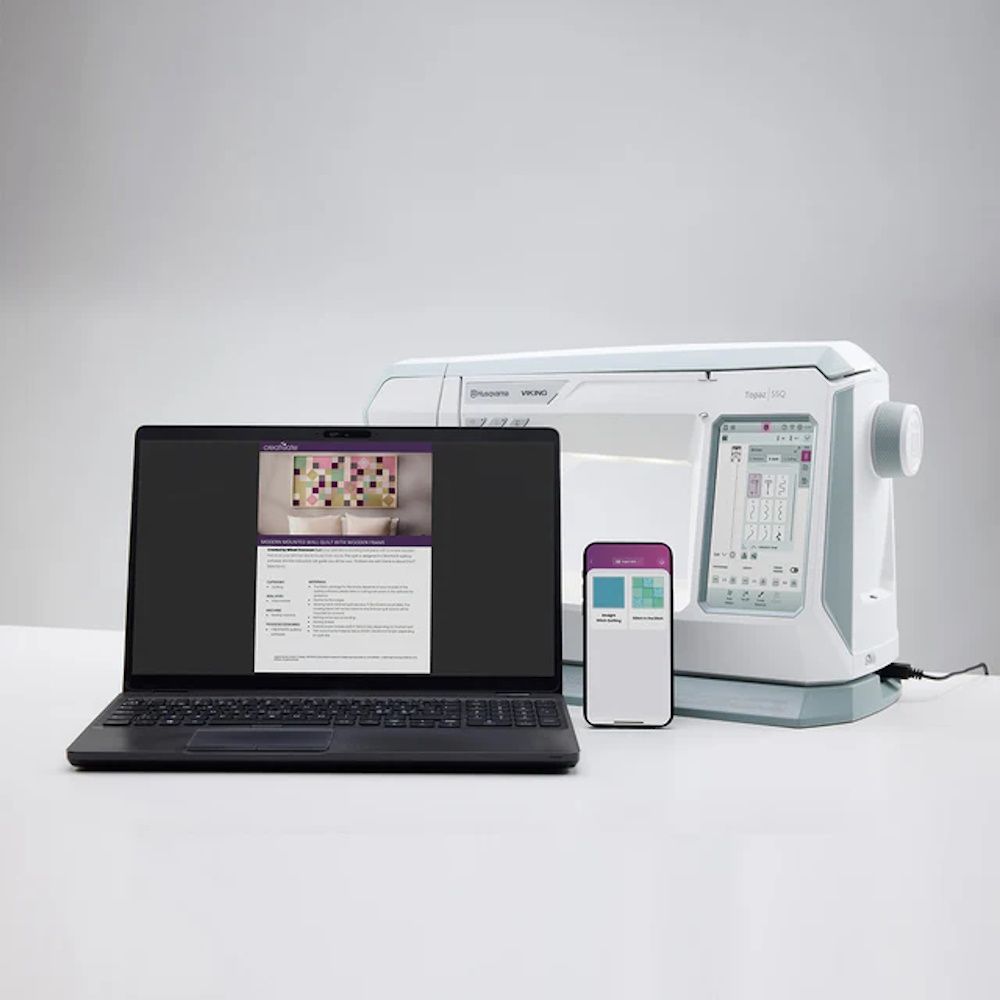 Husqvarna Viking Topaz 55Q sewing machine with CREATIVATE connectivity shown with laptop and smartphone integration