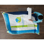 Overhead view of a quilter stitching a blue, white and lime quilt held around the machine by the Weightless Quilter frame.